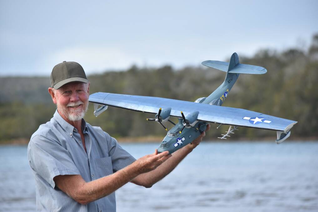 Plane passion: Lakewood's Bob Craine and his model Catalina, similar to the one Bob Hope landed in on the Camden Haven River in August 1944. Bob will be at the Slice of Haven on Sunday, May 26. Photo: supplied. 
