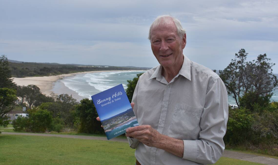 Bonny Hills Progress Association member Ian Simpson with the pictorial history book Yesterday & Today. 