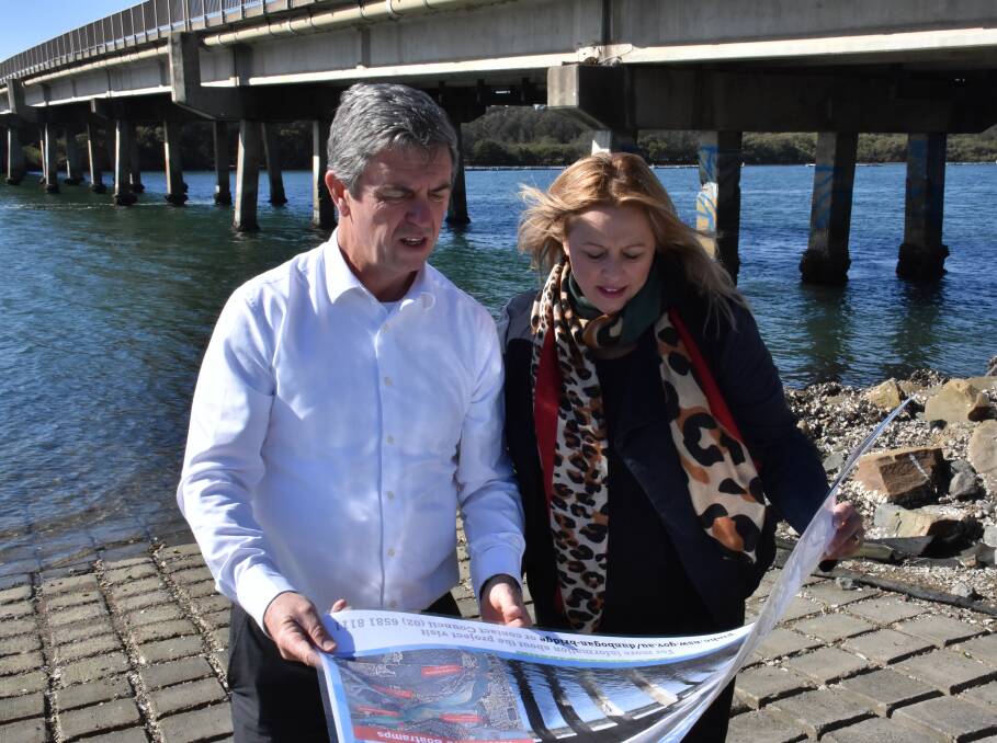 Federal Member for Lyne Dr David Gillespie and Port Macquarie-Hastings Council Mayor Peta Pinson examine the project's plans. 