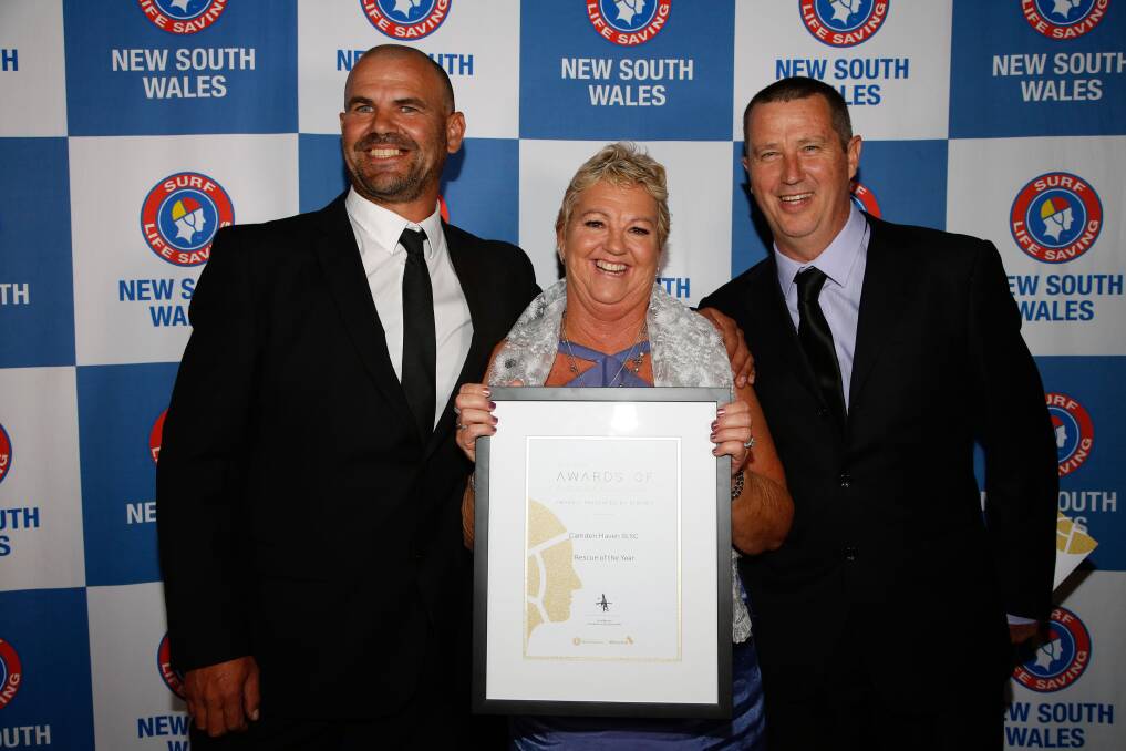 High achievement: CHSLSC club captain Tony Worton, president Michelle Garvan and IRB captain Phil Traves with their award on August 5. 
