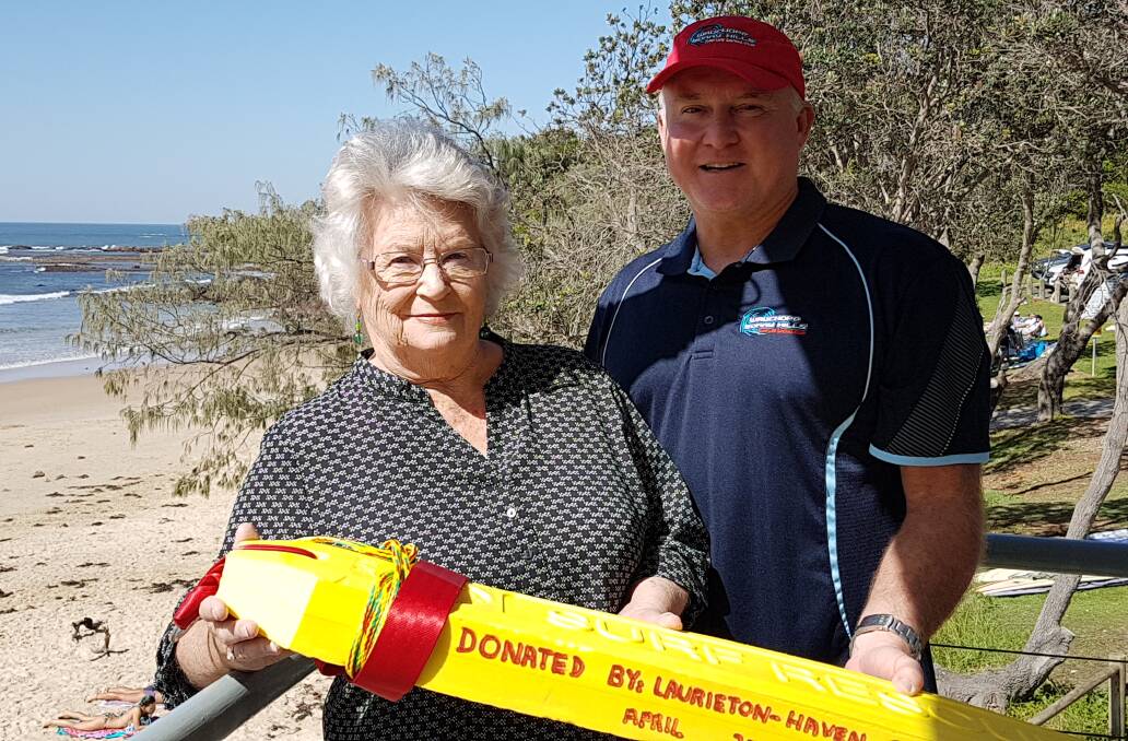 Vital equipment: Judy Molloy from the Laurieton Haven Craft Centre and Peter Smith, president of Wauchope Bonny Hills SLSC with the rescue tube. Photo: supplied. 