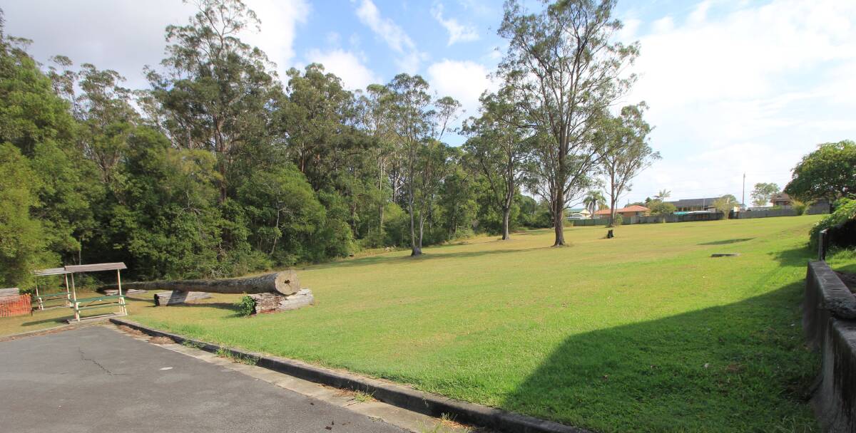 The area near the iKew centre is one option for the playground's location. It is situated north of the toilet block. The large log in the foreground will be assessed by council and moved to a more convenient location. Photo: supplied. 
