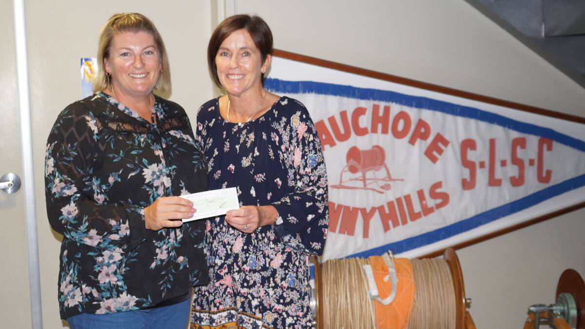 Valuable funds: Michelle Kirkwood hands over the $200 donation on behalf of Wauchope Bonny Hills Surf Life Saving Club to Denise Buckley. Photo: supplied. 
