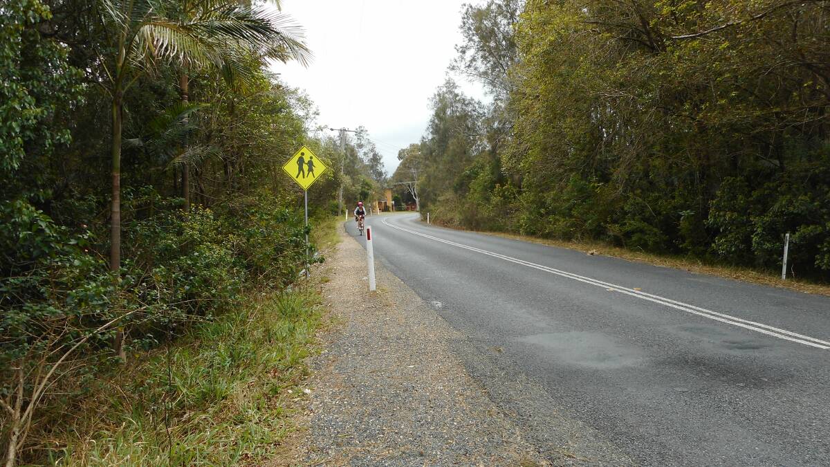 Resident captured this cyclist riding on the wrong side of the Boulevarde, Dunbogan to gain vision. Photo: supplied. 
