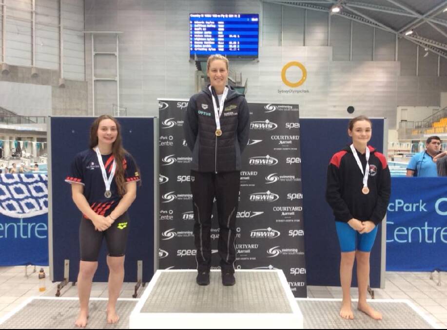 Champion: Laurieton's Sarah McIntosh on the podium for the bronze. Photo: supplied. 