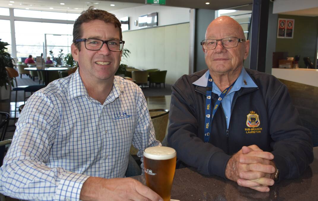 Laurieton United Services Club manager Rob Dwyer and Laurieton RSL president Budgie Parrot. The club's courtesy bus is now available any time during the day. 