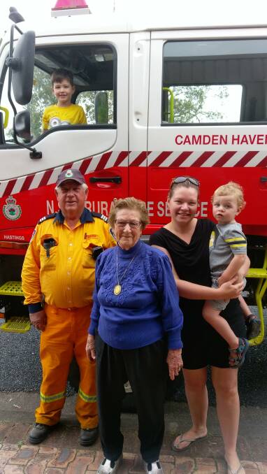 Community fundraiser: Camden Haven Rural Fire Service captain Ron Morris, Ada Latham, Hayden( in the truck), Simone and Henry Dring. 