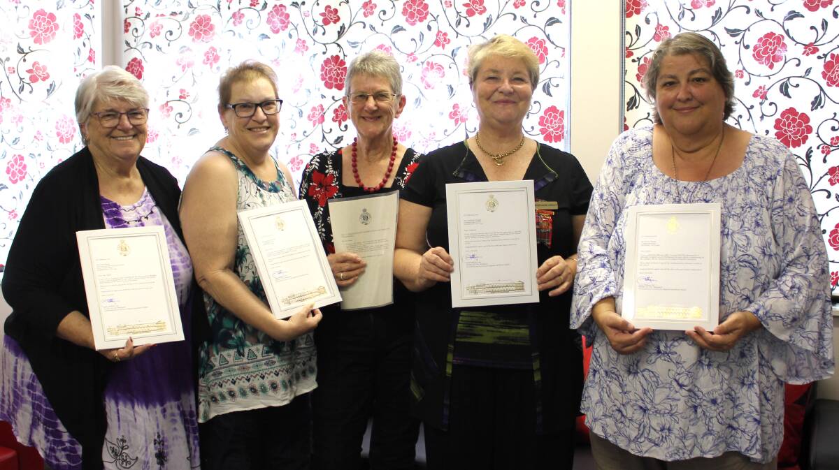 Camden Haven UHA Branch president Carol Smith with fellow volunteers Alayne
Menzies, Jenny Lucey, Stephanie Wright and Joanne Thorpe with their letters from Port Macquarie MP Leslie Williams in recognition of their hard work. Photo: supplied. 