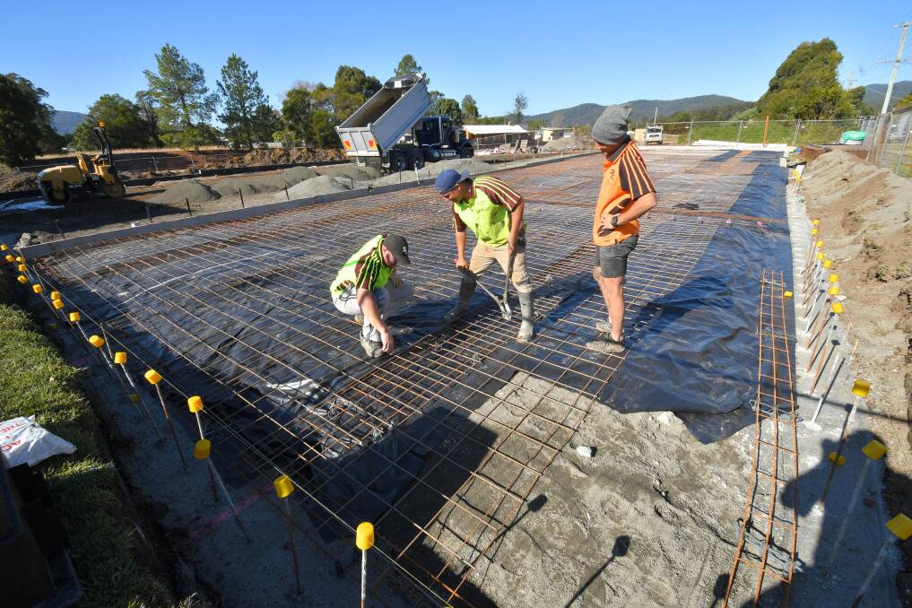 All go: Workers at the construction site for the new Kendall Tennis Club courts. Photo: Ivan Sajko. 