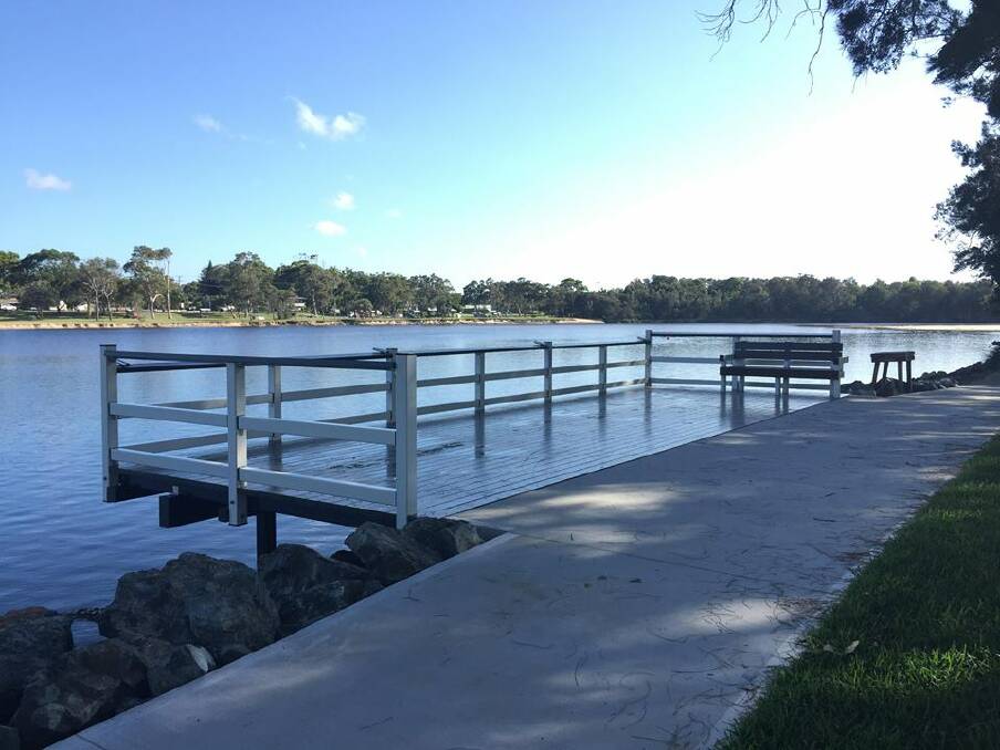 The fishing platform has hand rails on the sides and a low guard rail along the water side to allow ease of casting for people in a wheelchair.