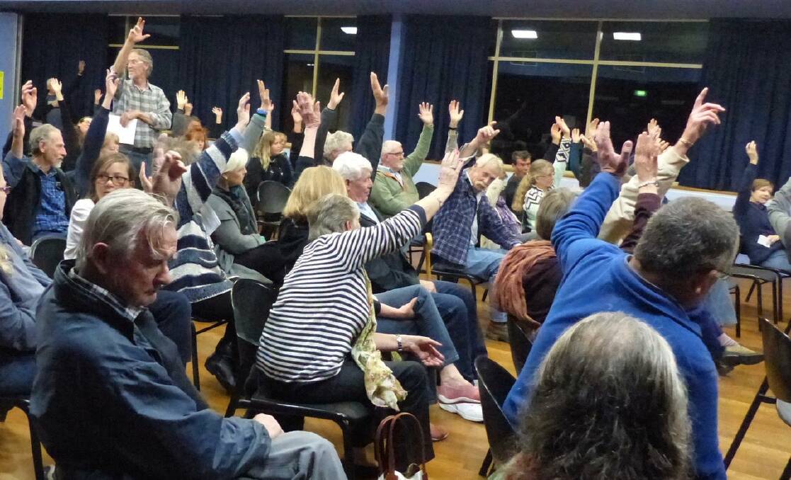 A show of hands from people at the July 19 meeting who are against the development at Kendall. Photo: supplied. 