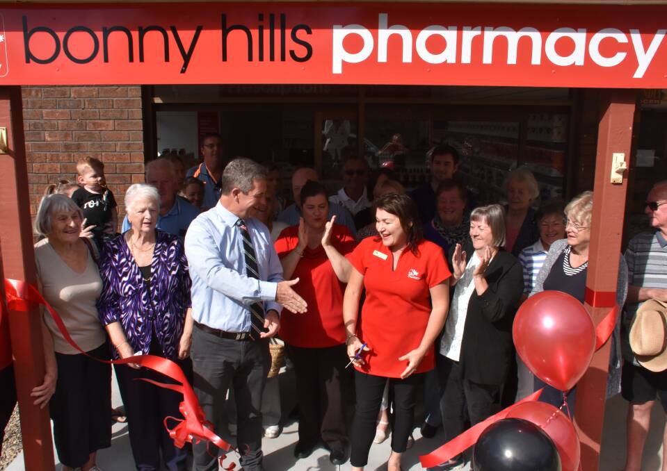 Official opening: Member for Lyne Dr David Gillespie congratulates pharmacist Karen Rees-Pikett at the opening of the Bonny Hills pharmacy on May 13. 