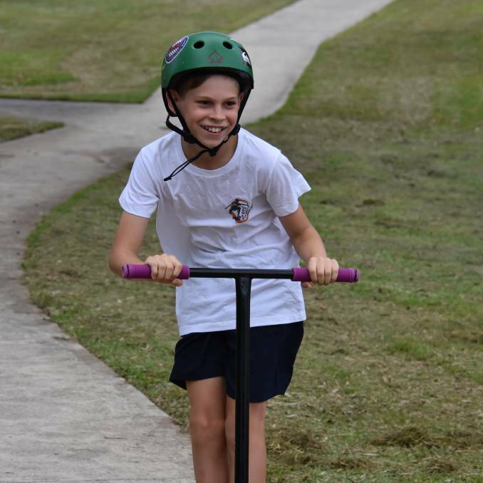  All smiles: 11-year-old Levi Robinson can't wait to ride his scooter at the new skate and recreation park at Lake Cathie. 