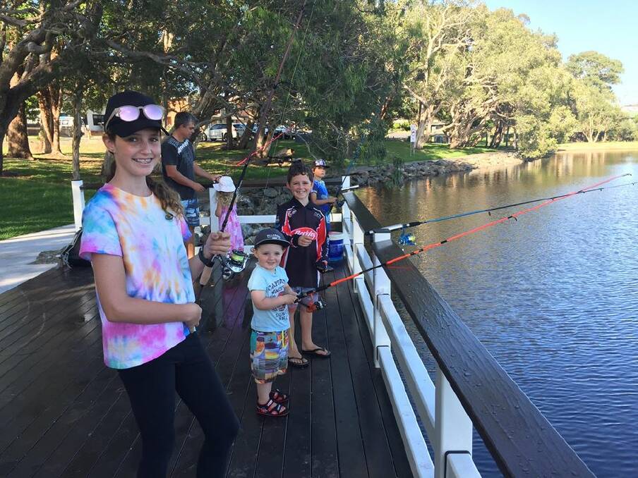 Fishing fun: Briella, Flynn and Isaac Meyers hope to reel a big one in at Lake Cathie. 