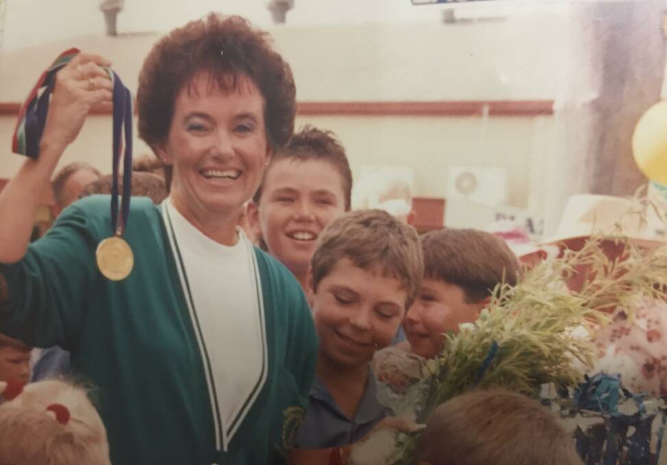 Daphne pictured with her gold medal amongst fans in 1990 