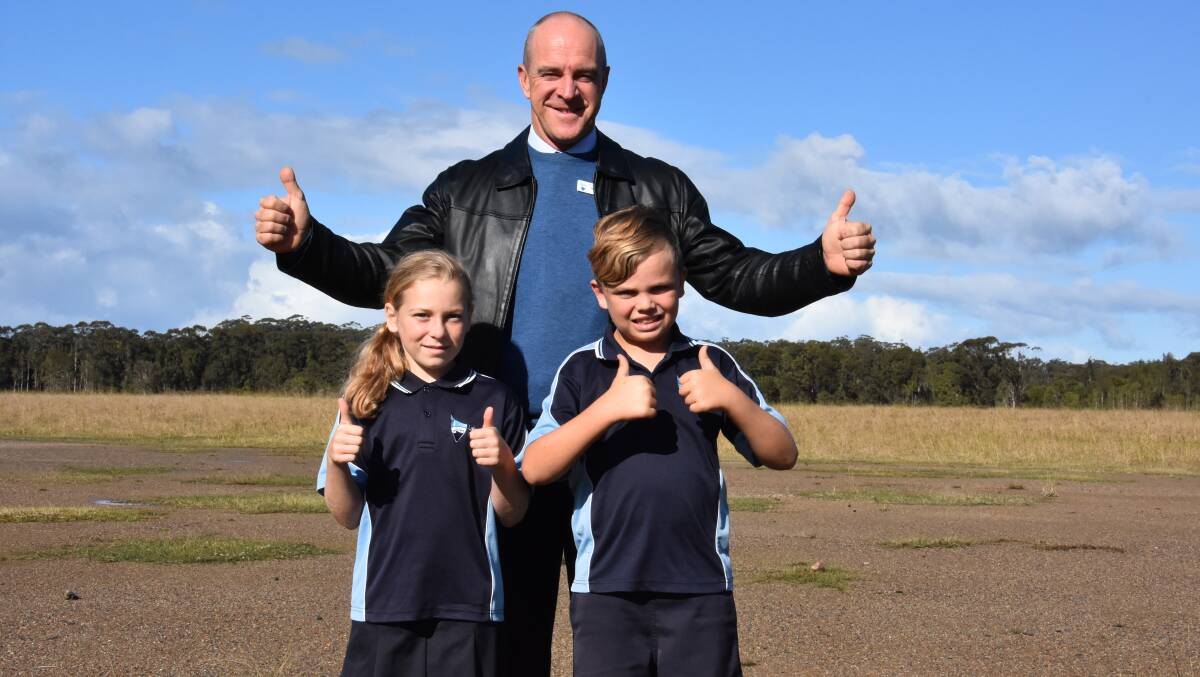 Thumbs up: Lake Cathie Public School principal Jock Garvan with students Freya Briggs and Ekana Pemberton. Freya and Ekana are members of the Lake Cathie Raiders and are looking forward to playing on the new fields. 