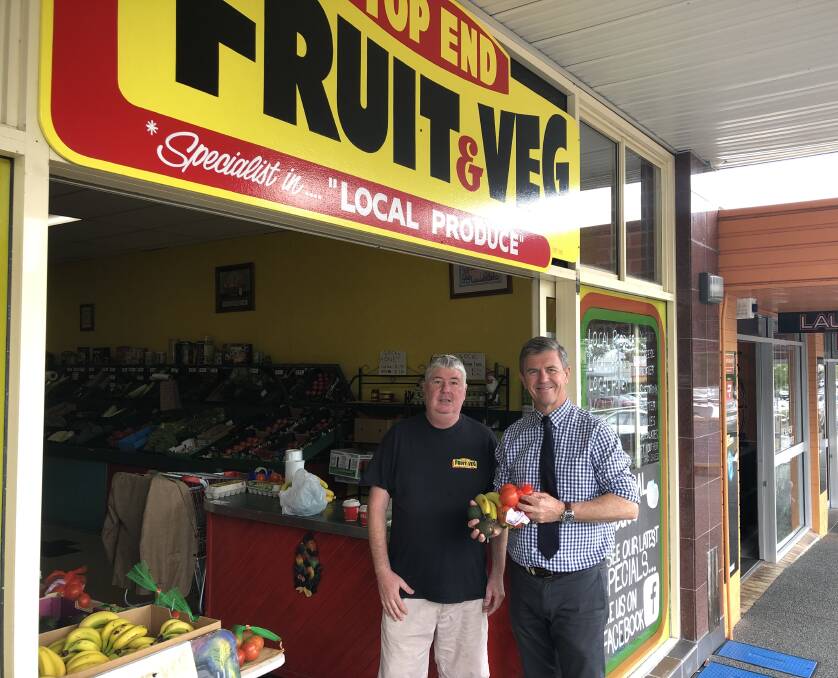 Graeme Martin from Top End Fruit and Veg recently had to move his outdoor display table inside. He was visited by Federal Minister for Lyne Dr David Gillespie. Photo: supplied. 