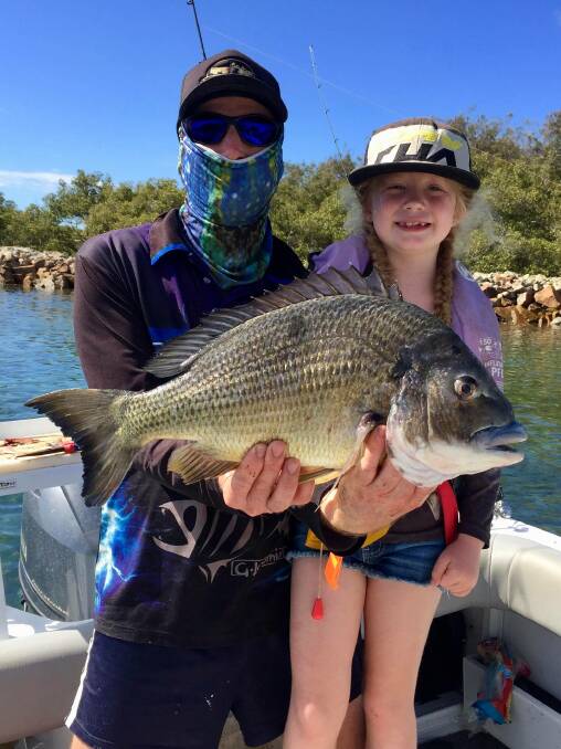 What a catch: Matthew and Macey Hutchison with the record-breaking bream. Photo: supplied. 
