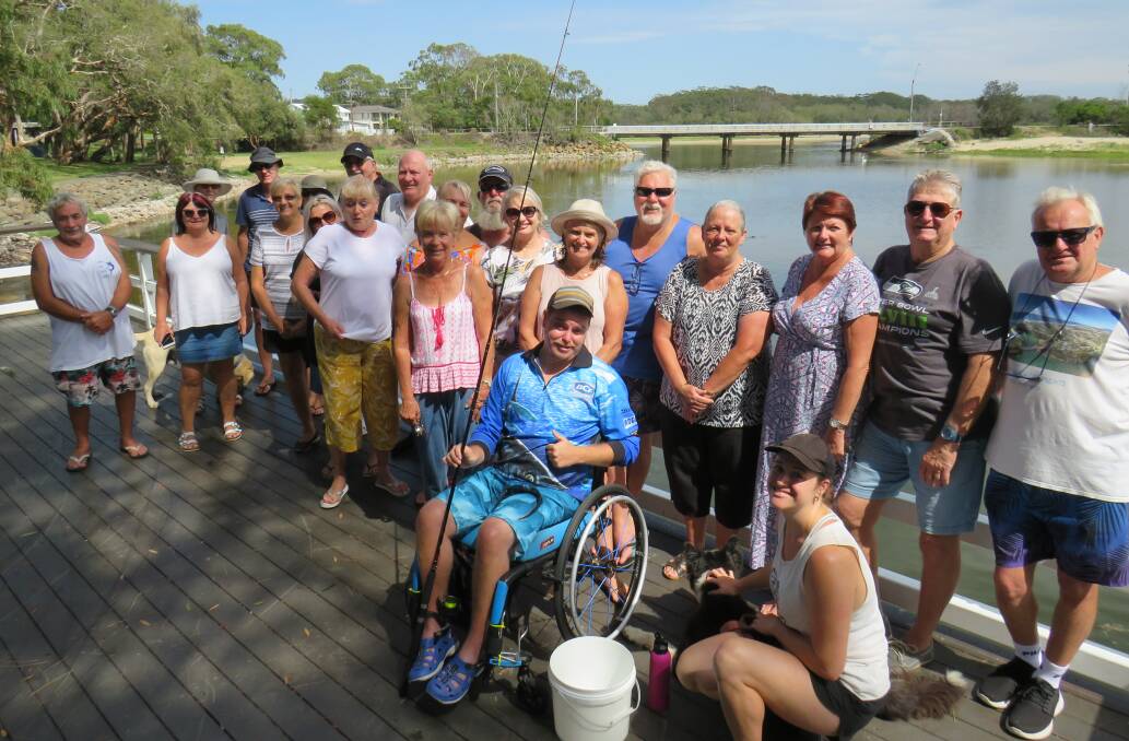 Call for action: Byron Moody (front) surrounded by concerned community members at Lake Cathie. 