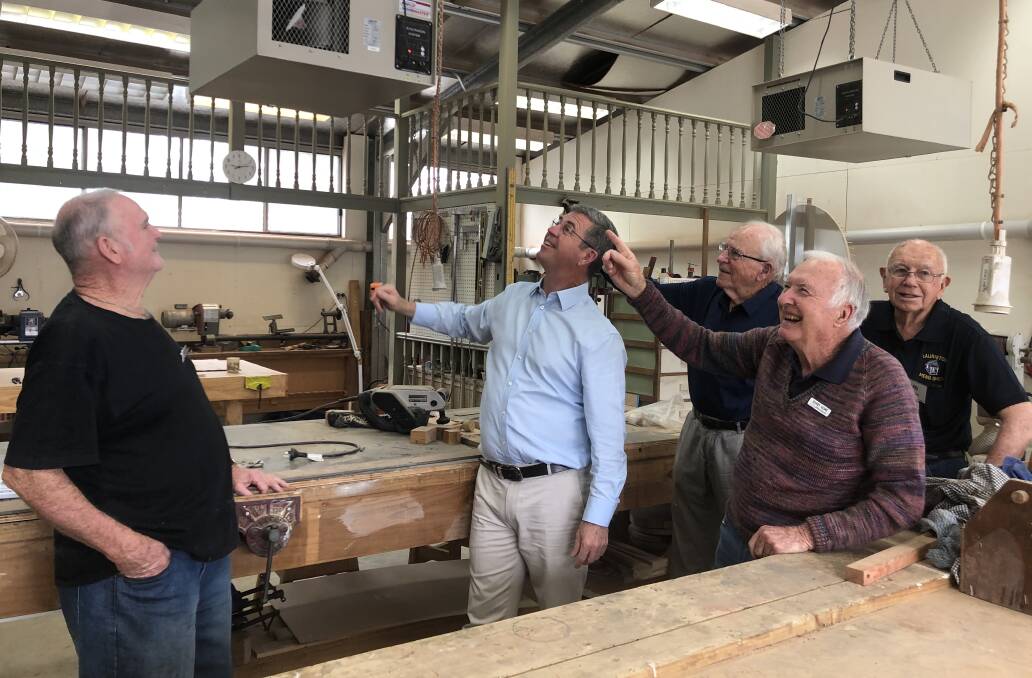 Pictured are David Gillespie with a few members inspecting new air cleaners provided with a grant of $1797 from the Kendall Op-Shop which will assist with keeping dust at bay for the volunteers and members of the shed.