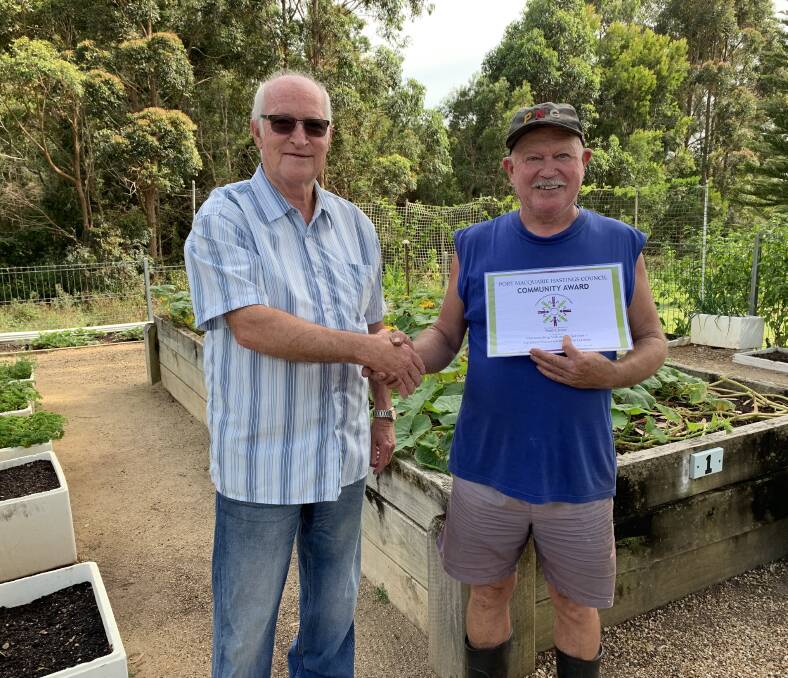 Recognition: Camden Haven Community Garden president Tony Carroll with volunteer Paul Crowe. 
