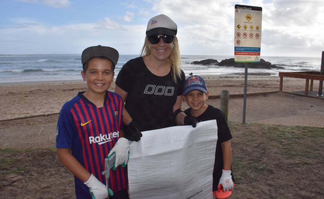 Great work: Charlie, Lara and Aidan from Lorne attended the Town Beach clean up in Port Macquarie. 
