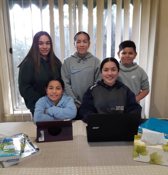 TEAM: (clockwise from back left) Edna, 18, Atelaite 12, Raymond, 10, Kailani, 9, and Lieszel, 14, work together to support each other as a family team for remote schooling. Picture: supplied