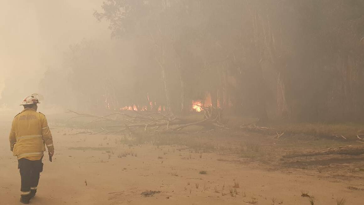 Wauchope RFB crew member at the Crestwood end of the fire. Photo: Wauchope RFB, Facebook.
