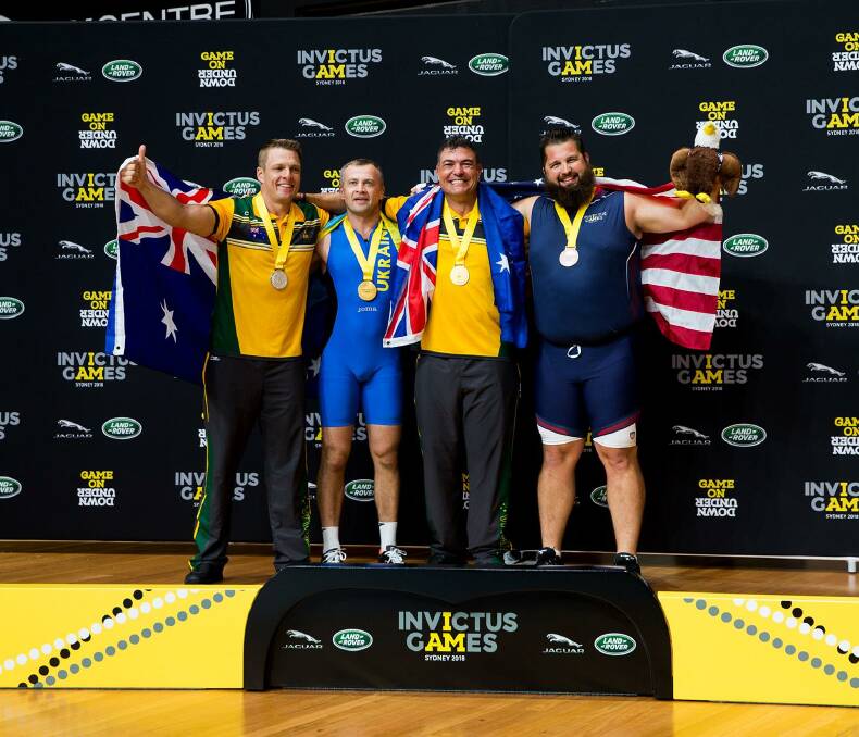 Silver: Matt Model (left) wins silver in the indoor rowing event. Photo: Invictus Games: Team Australia, Facebook.