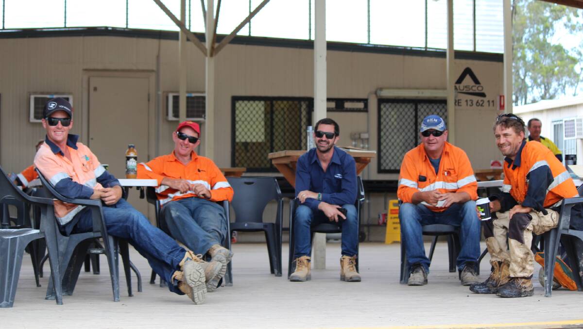 Well deserved break. The road construction crew are all smiles on official opening day.