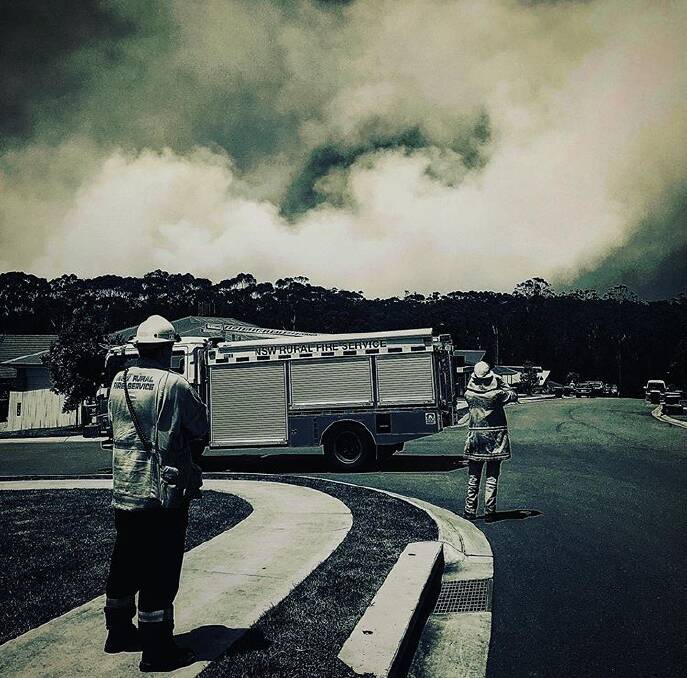 Watch and wait: Sancrox-Thrumster RFS crews at The Ruins Way watching to see if the wind will impact the fire's direction. Photo: Tracey Fairhurst.