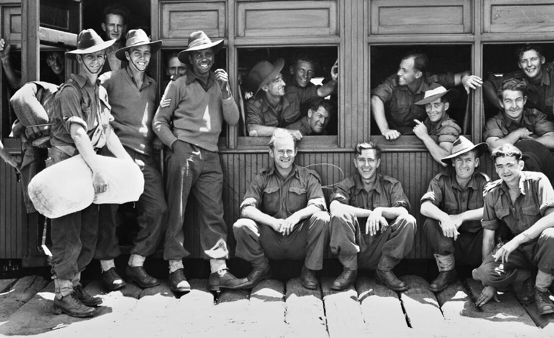 A young Reg Saunders surrounded by his mates of the 2/7th Battalion, AIF, in Queensland in 1943 (detail). 057894, image courtesy of the Australian War Memorial.
