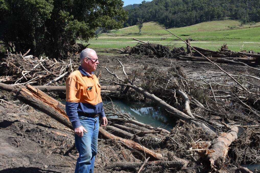 COMMUNITY MEETINGS: Rollands Plains cattle farmer Phil Morton surveying damage from flooding.