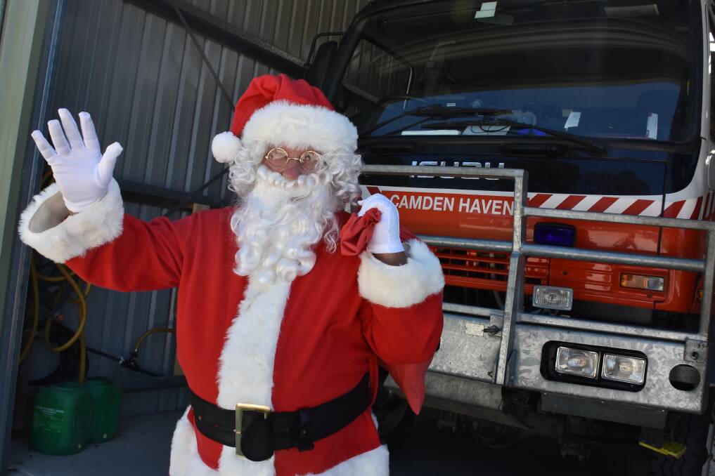 CHRISTMAS CHEER PARADE: Santa with a Camden Haven truck.
