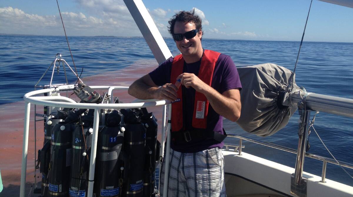 Out in the field: Oceanographer Doctor Daniel Harrison sampling a plankton bloom off Sydney.