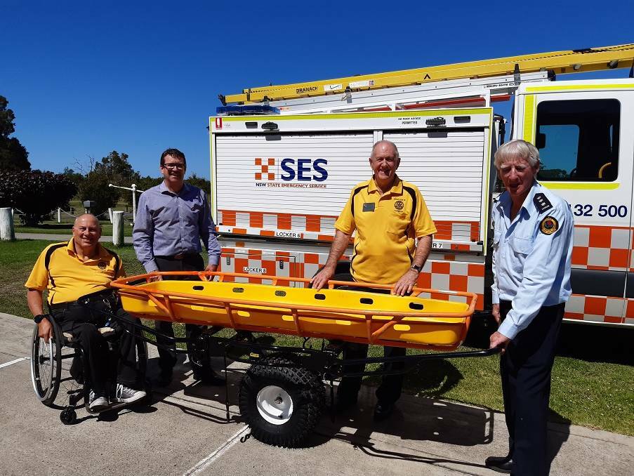 NEW EQUIPMENT WELCOMED: SES unit commander Gordon Hutchison receiving the Stokes litter from Rotarians Noel Hiffernan and Ian Jackson in partnership with LUSC chief executive Rob Dwyer.