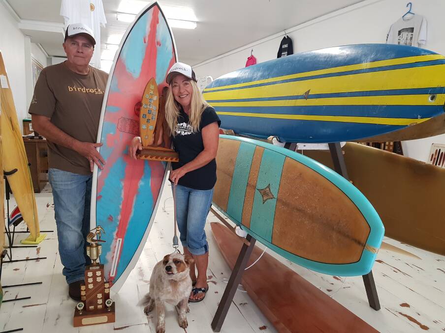 Port Macquarie Surfing Museum: Committee member Geoff Branch, Mid North Coast Girls Surfriders president Robyn Wallace and Chilli with the Bird Rock Memorial Surf Classic trophy.