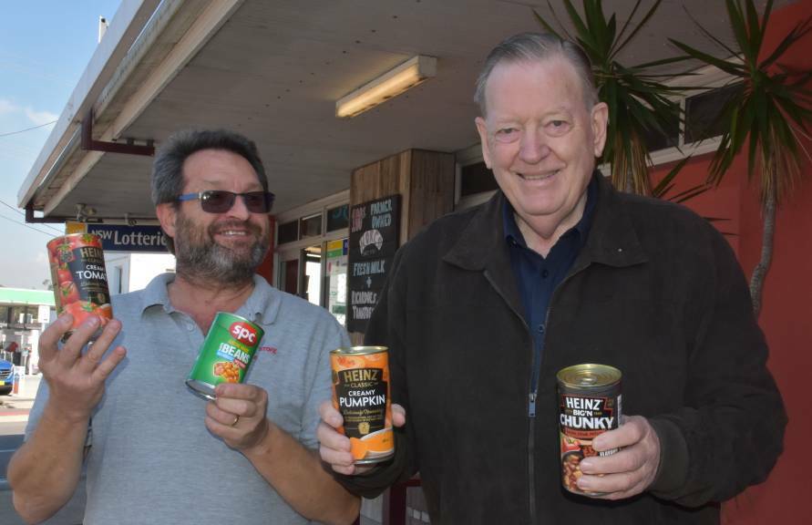 HELPING RESIDENTS WITH DONATIONS: Steffan Andler and Theo Hazelgrove with non-perishable food items at the Kew Corner Store.