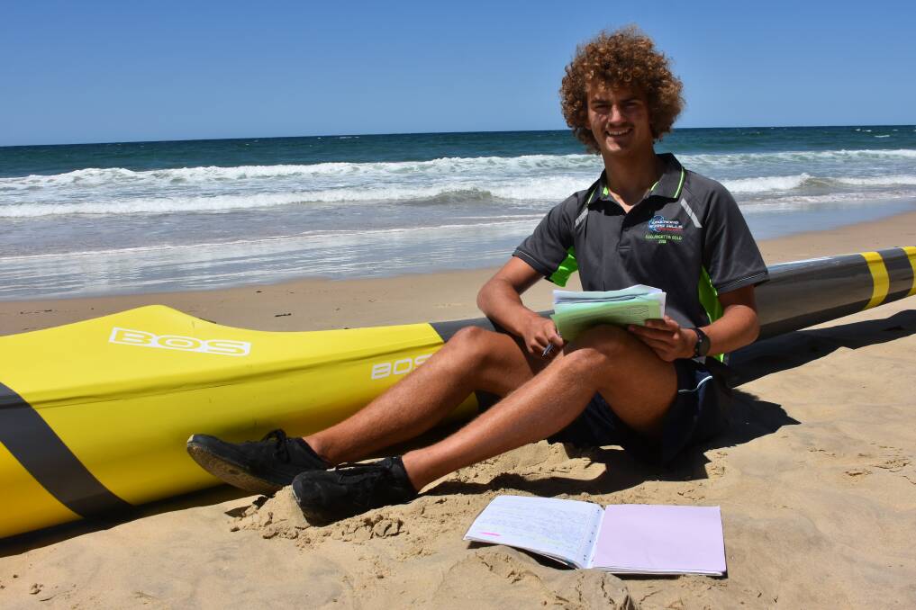 STUDYING IN THE SURF: Wauchope-Bonny Hills junior club captain Chayce Anderson.