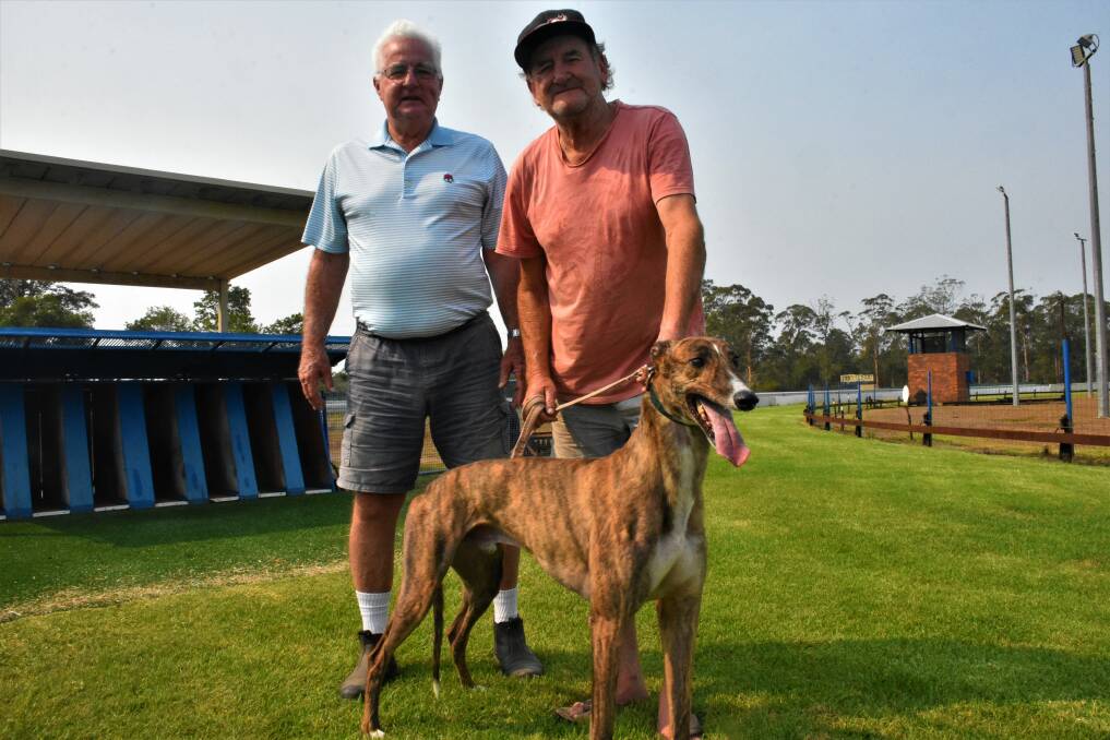 HISTORIC EVENT: Hastings River Greyhound Racing Club president Rex Nairn, Beechwood trainer Karl Miller with Bourne Appeal.
