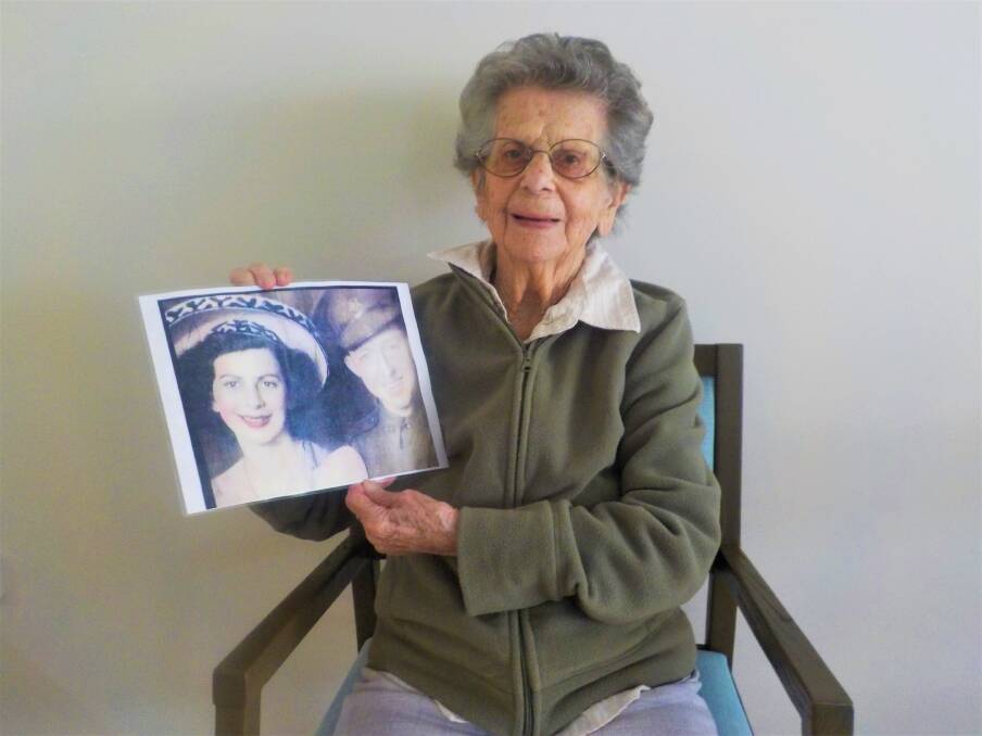 CENTURY OF LIFE: Lorne cattle farmer Hazel Monck with her historical photo. Photo: Laurieton Lakeside Aged Care Residence.