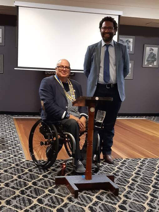 NEW LECTERN: President Noel Hiffernan with Roger McCosker and the new lectern. Photo: Supplied.