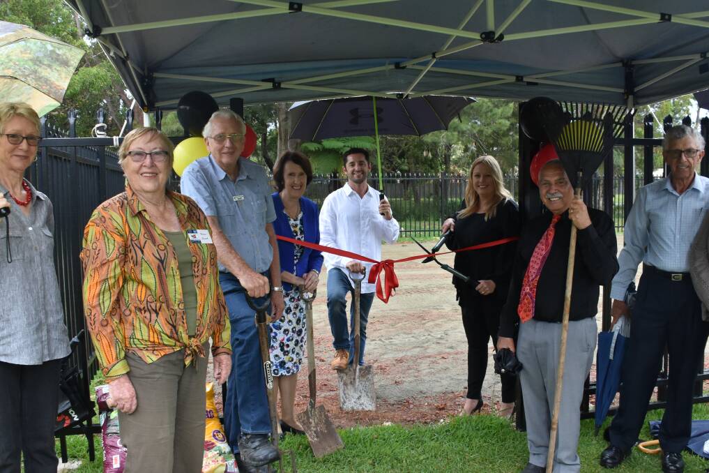 OFFICIALLY OPEN: Member for Port Macquarie Leslie Williams, Mayor Peta Pinson and Birpai elder Uncle Bill O'Brien with garden club members at the ribbon cutting.