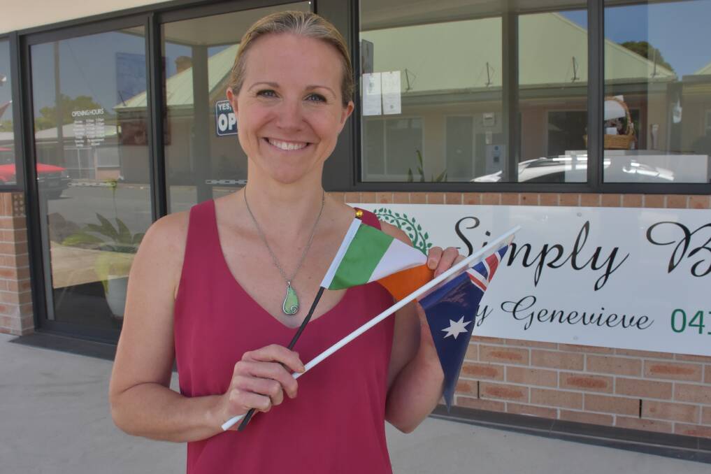 OFFICIALLY AUSTRALIAN: Kendall business owner Genevieve Hoare with flags of Australia and Ireland.