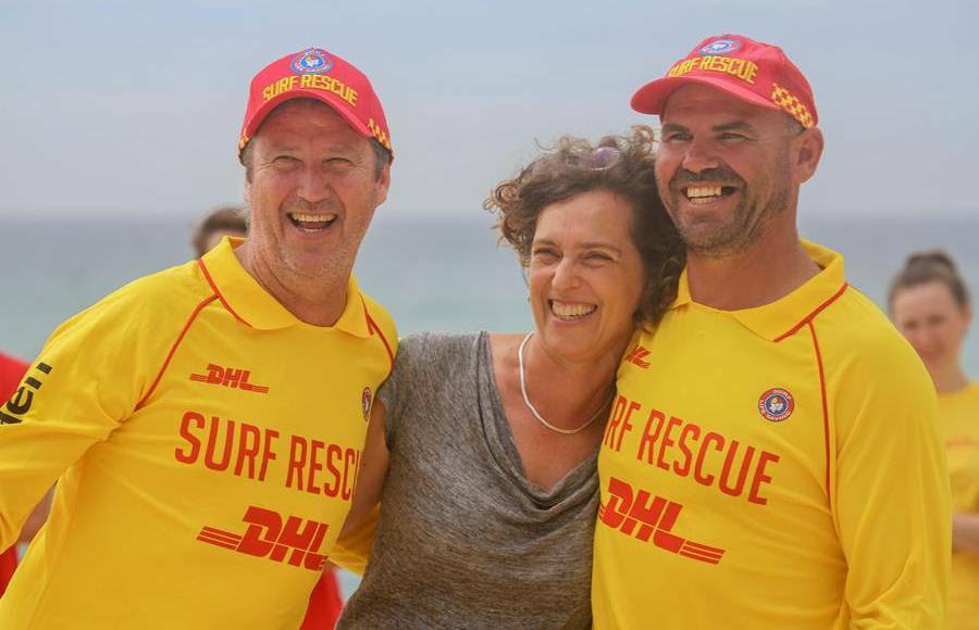 ON THE BEACH: Phil Traves, Samantha Morley and Tony Worton. The surf club champions were honoured in 2020 for their rescue of the young mum. Photo: SLSNSW.