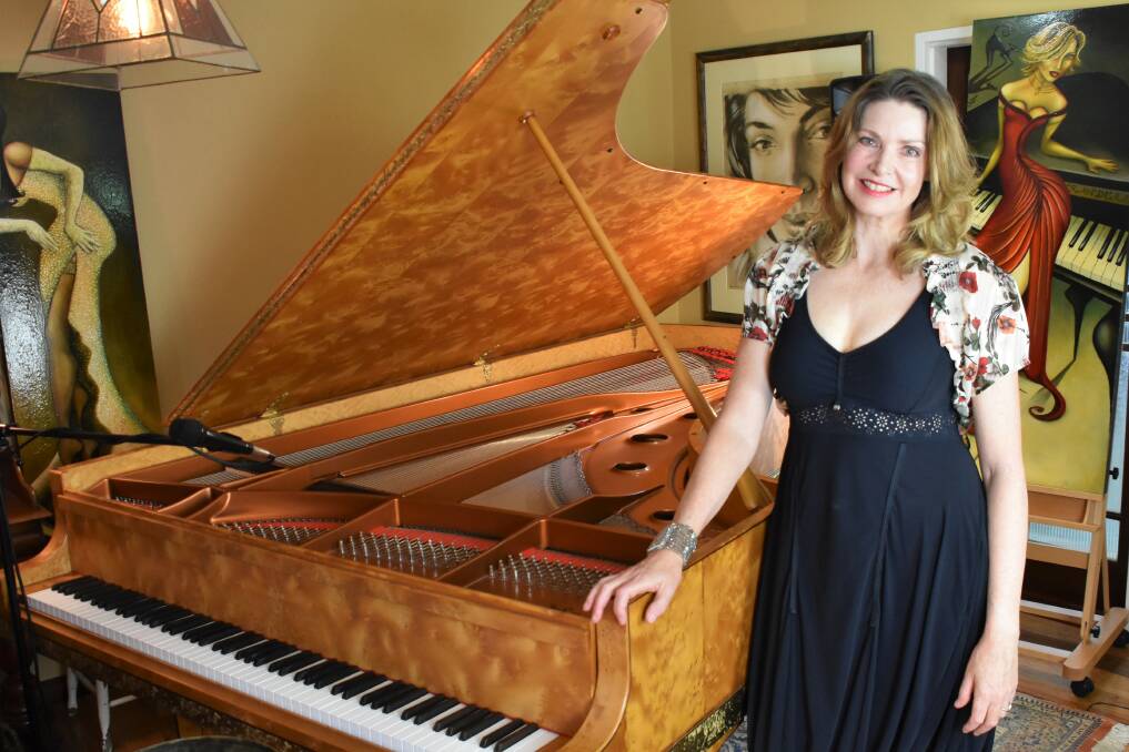 INNOVATION IN MUSIC: Kendall resident and musician Fiona Joy Hawkins with her handmade Australian piano.