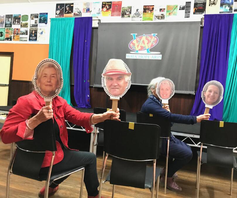 Creative concept: Krissa Wilkinson holds up cutouts of herself and Michael Eddie, and Susan Ashton holds up cutouts of herself and Jan Dennis to promote the fundraiser. Photo: Jan Dennis