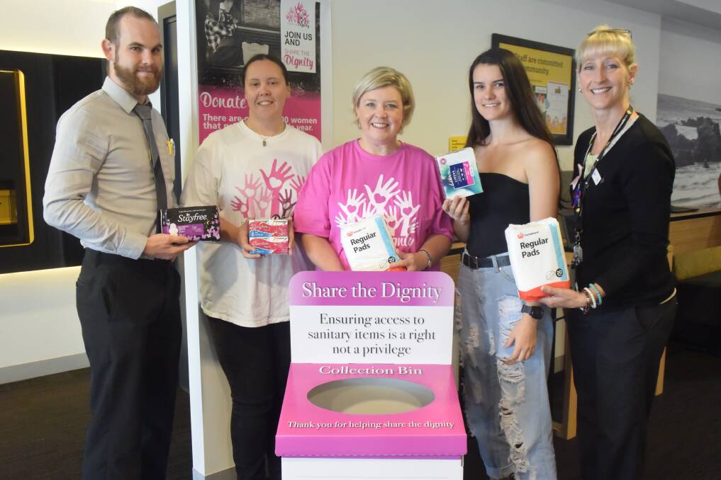 Call for donations: Commonwealth Bank customer banking specialist Matt Bruce, Share the Dignity volunteers Kate Fitzgerald, Mel Haverfield and Tahlia Rance, and Commonwealth Bank customer service representative Julie Chambers support the dignity drive.