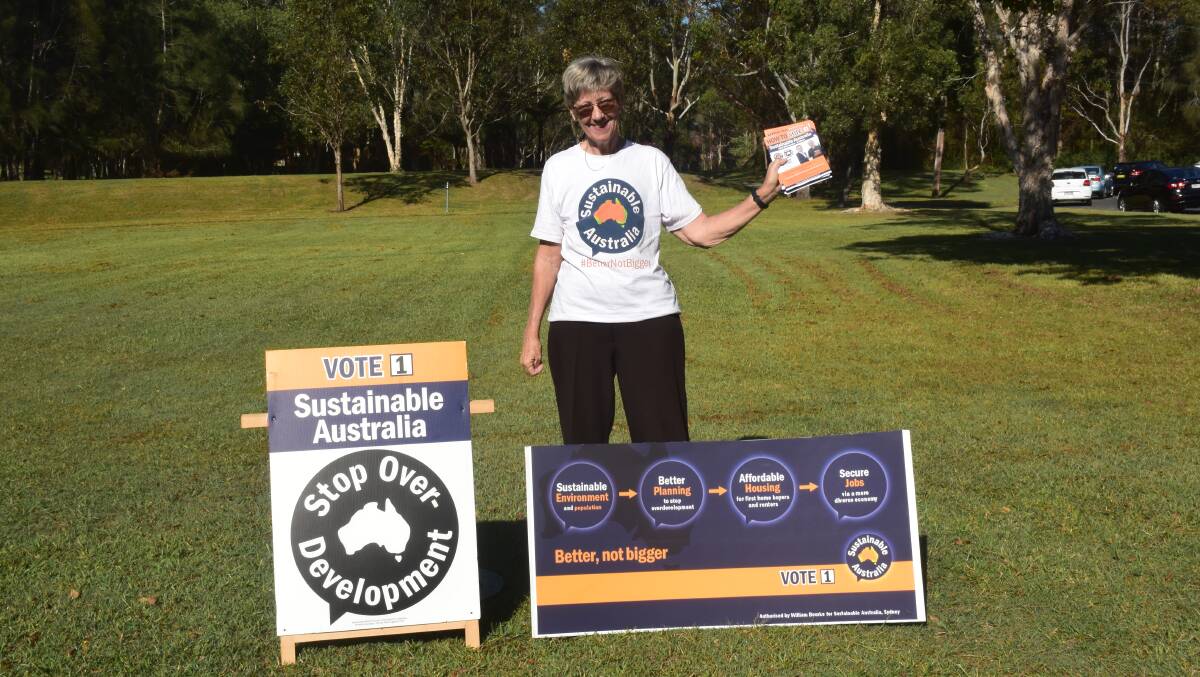 Raising awareness: Sustainable Australia candidate for the seat of Port Macquarie Jan Burgess at Lake Cathie on election day.