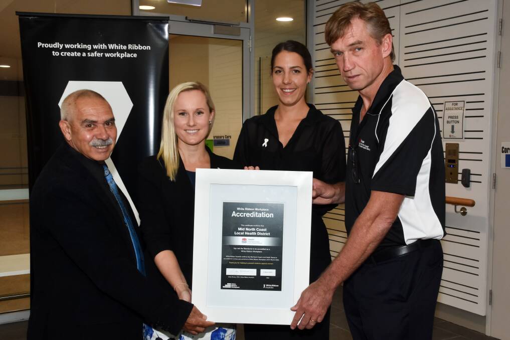 Leading the way: Uncle Bill O'Brien, Dr Angela Jay, Jennifer Mullen and Stewart Dowrick display the White Ribbon workplace accreditation certificate.